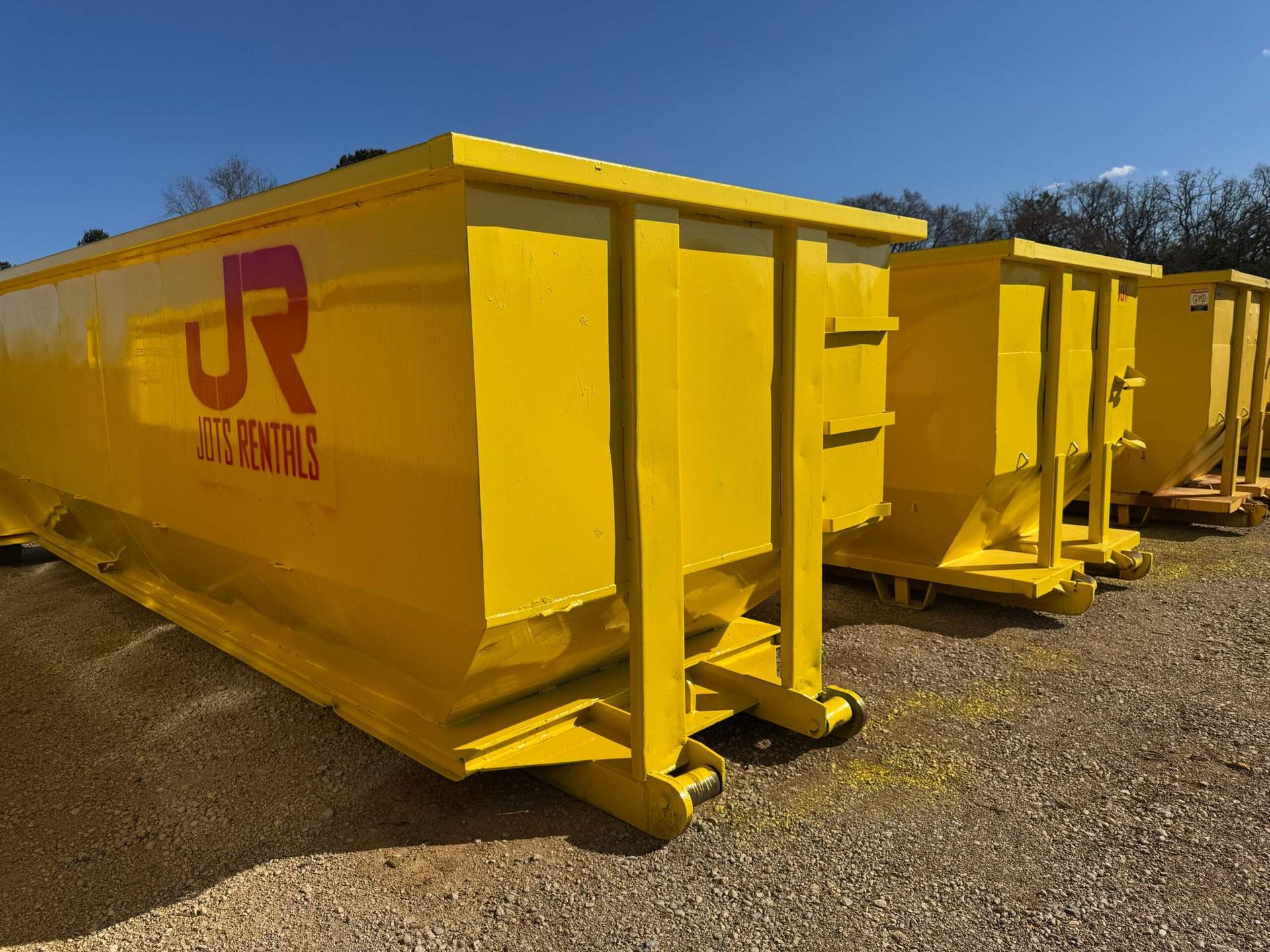 Roll-off dumpsters in multiple sizes at a JOTS yard